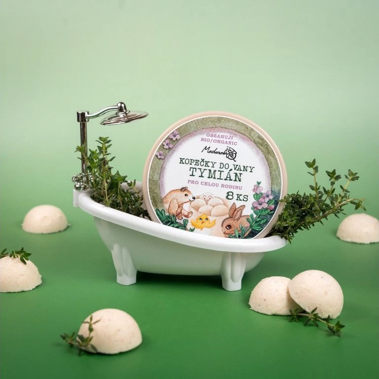 Medarek Thyme Bath Melts (8 pcs) tin in a miniature bathtub with fresh thyme sprigs on a green backdrop